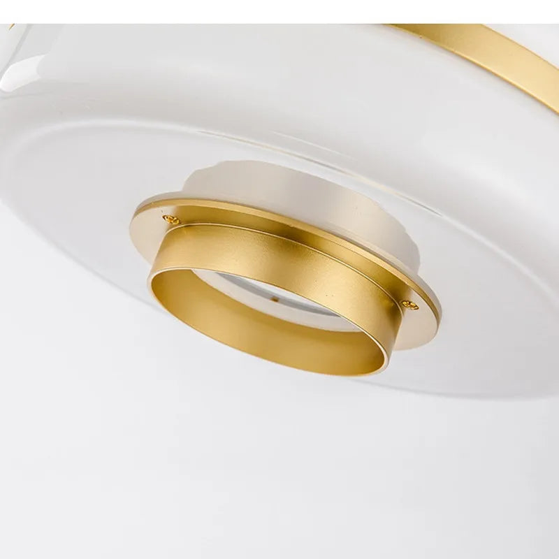 Nordisk glass- og metallpendel fra Nyra med varm LED-glød | Snurv